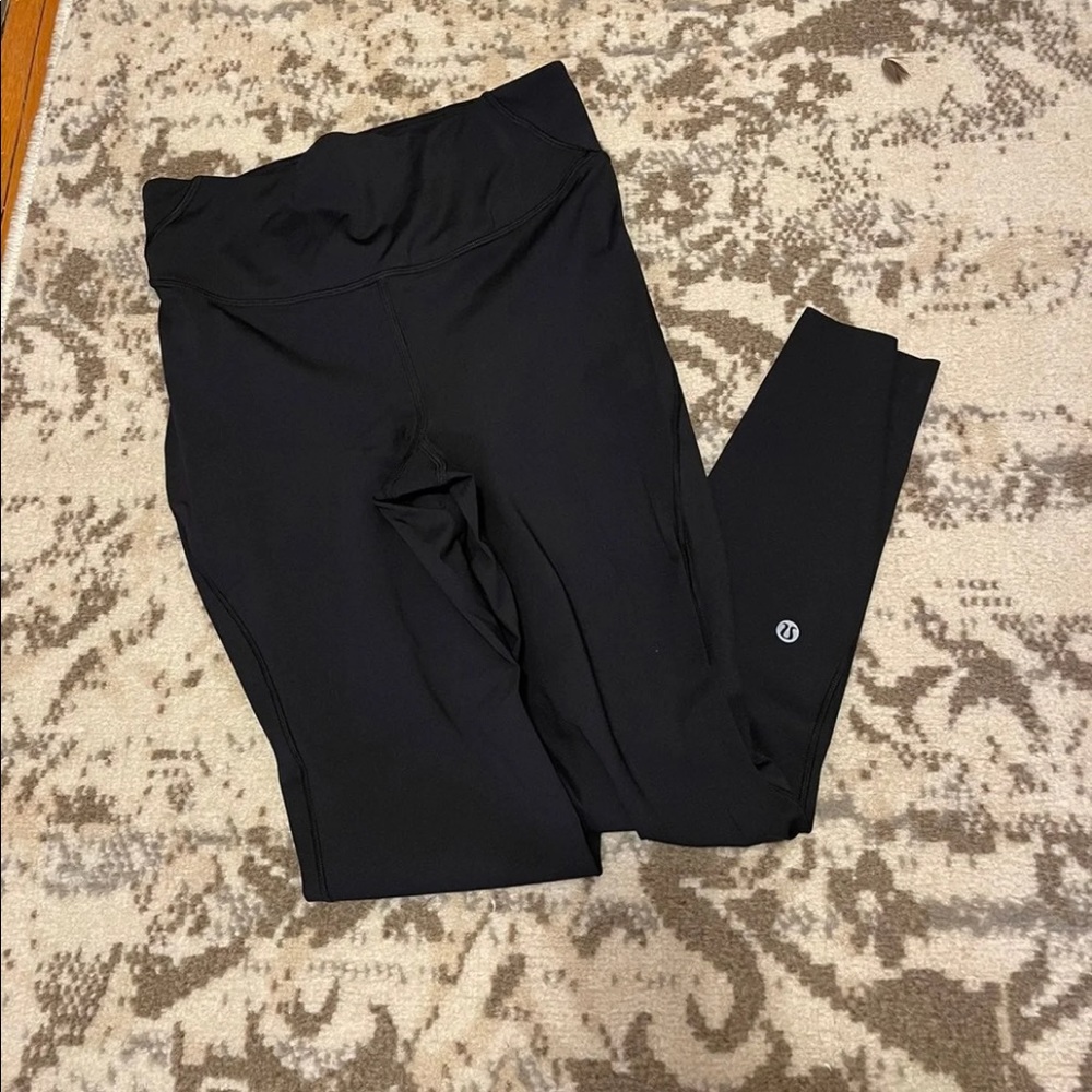 Black Lululemon Base Pace leggings size 8 with a 25” inseam